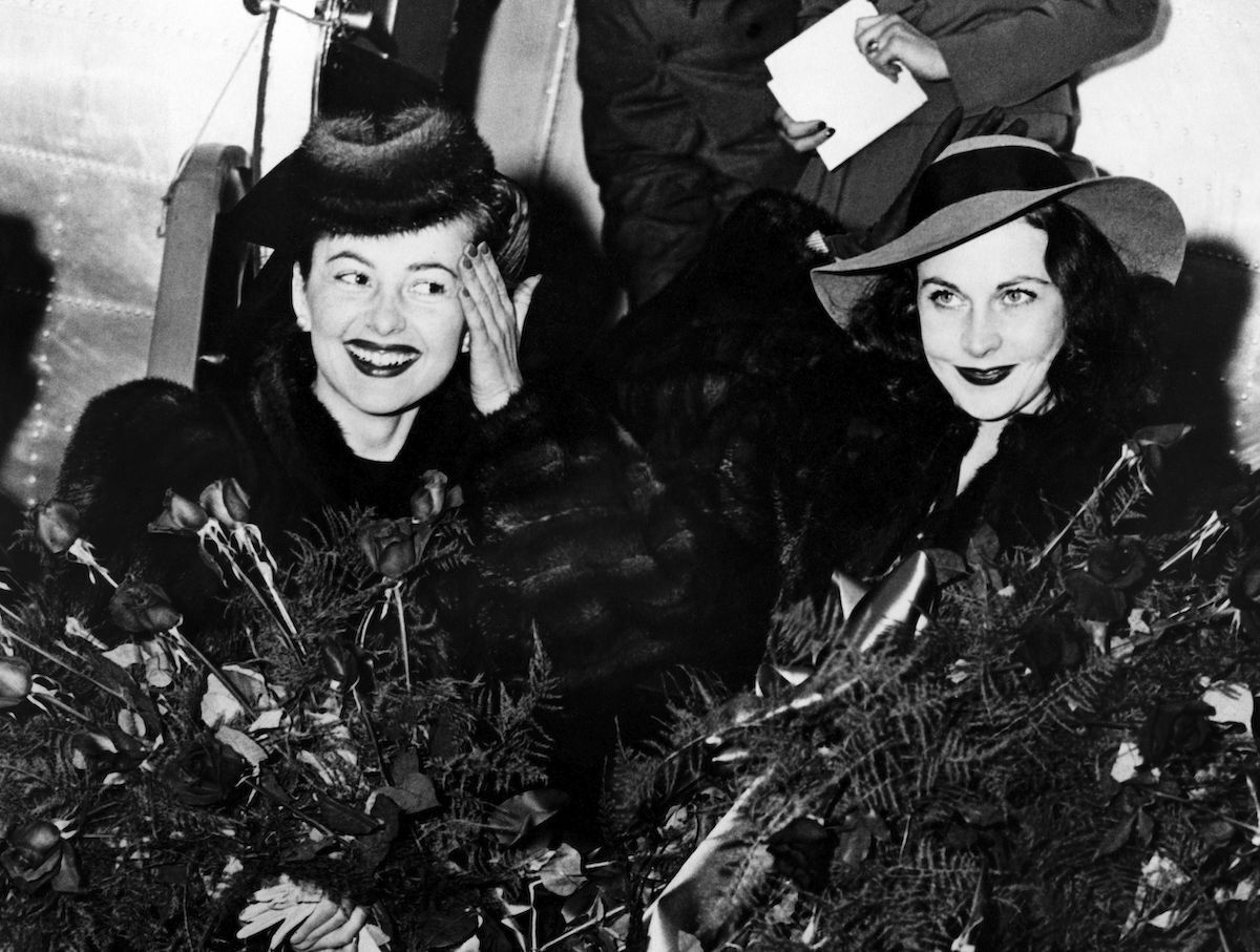 Olivia de Havilland and Vivien Leigh stepping off of a plane in Atlanta, Georgia in 1939