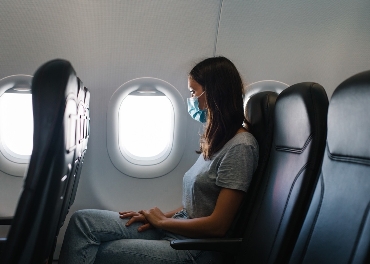 She looks out the window, as she waits for plane to take off