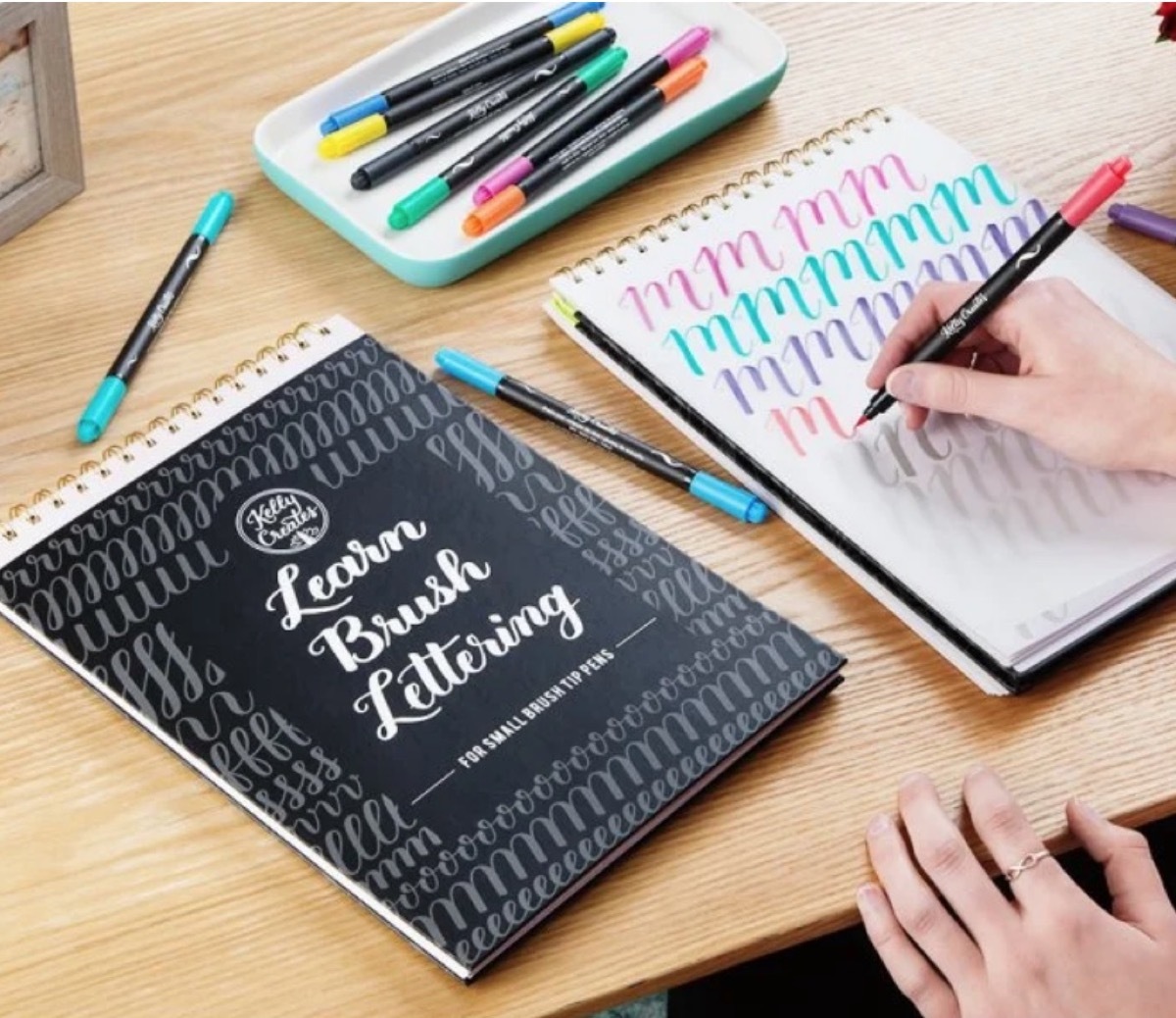 white hand writing calligraphy