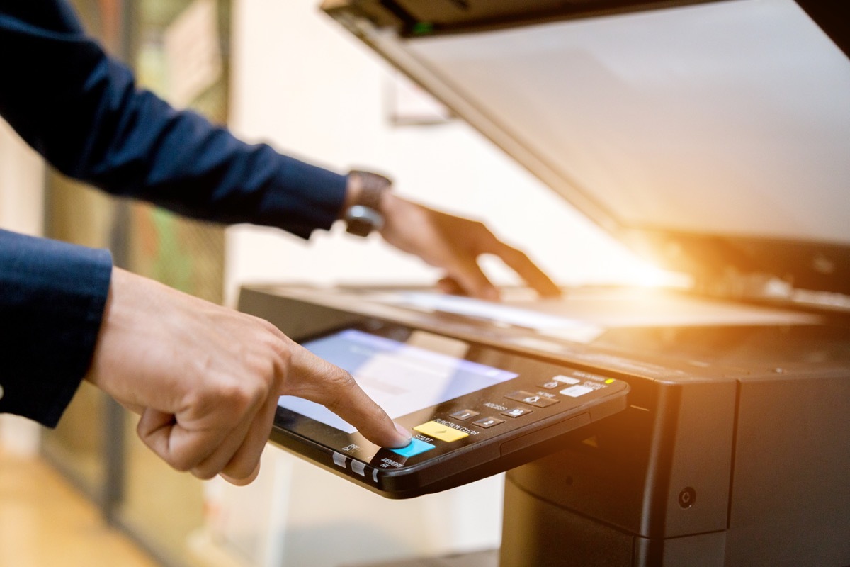 Person using the photocopy machine office germs