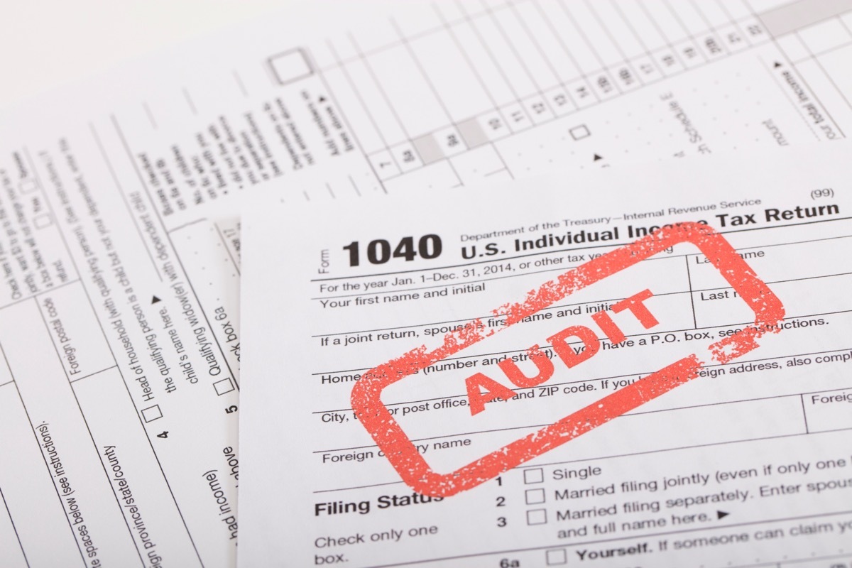 A stock photo of a Red Audit stamp on a 1040 US individual income tax return. Photographed at 50mp with the Canon EOS 5DSR and the 100mm 2.8 L lens.