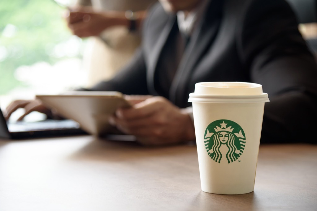 Starbucks coffee order and a man with a tablet.