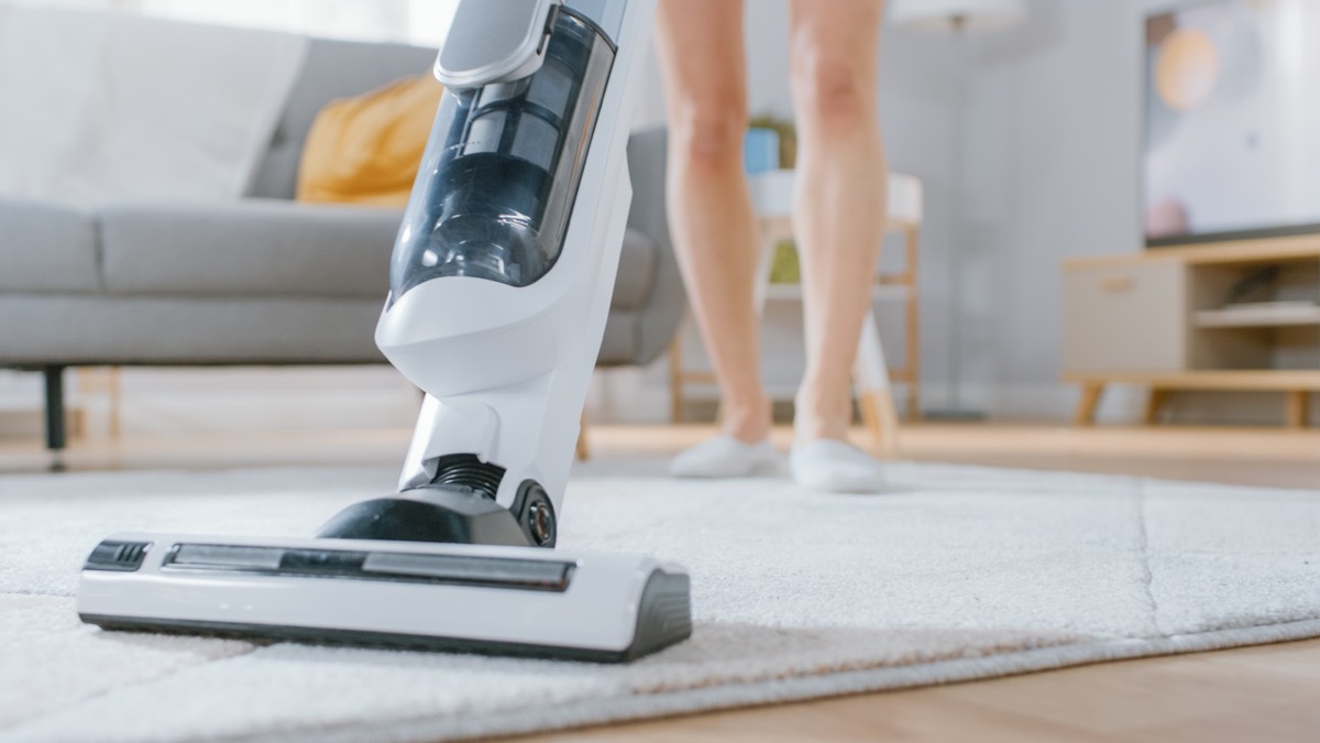 Woman Vacuuming Living Room