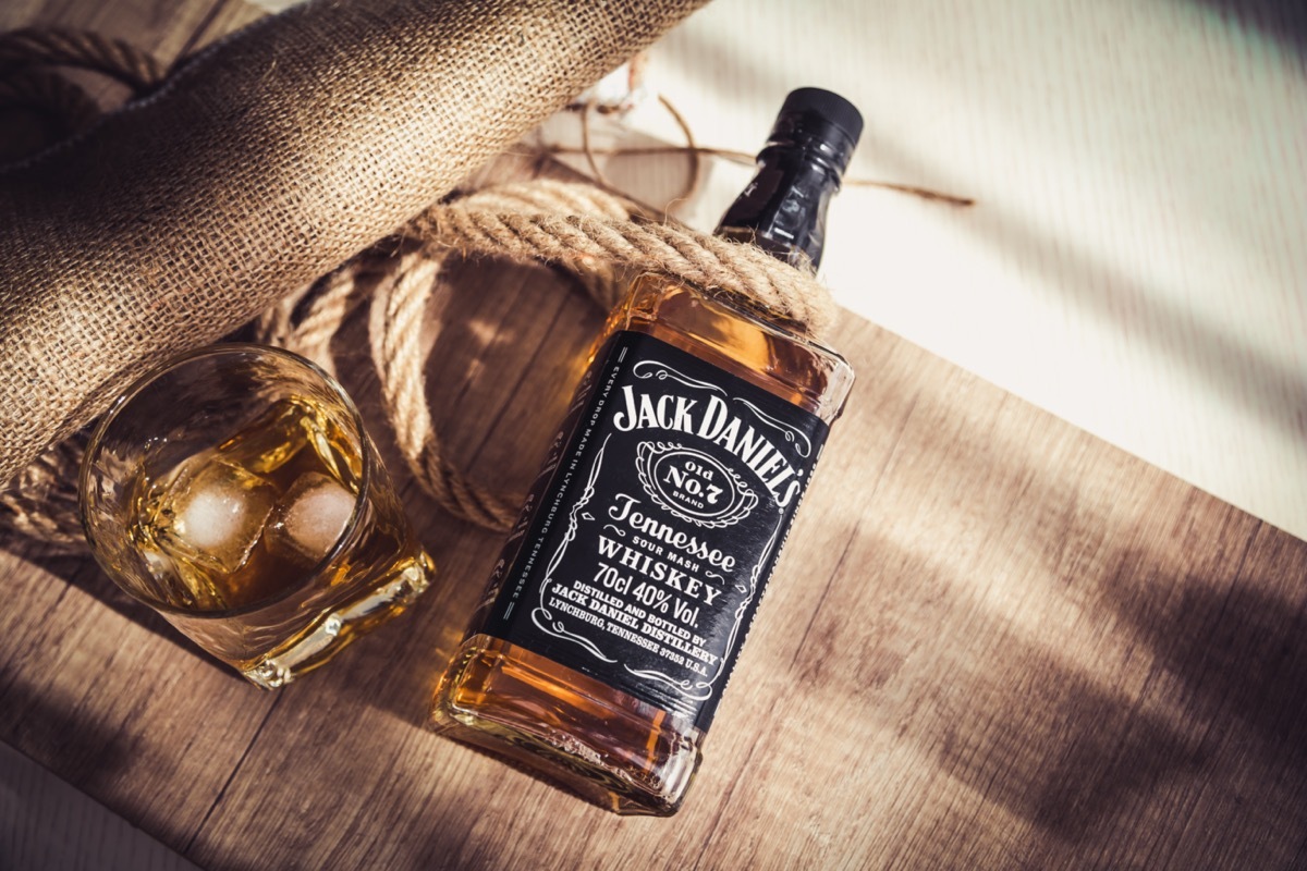 Jack Daniel's bottle and glass on cloth