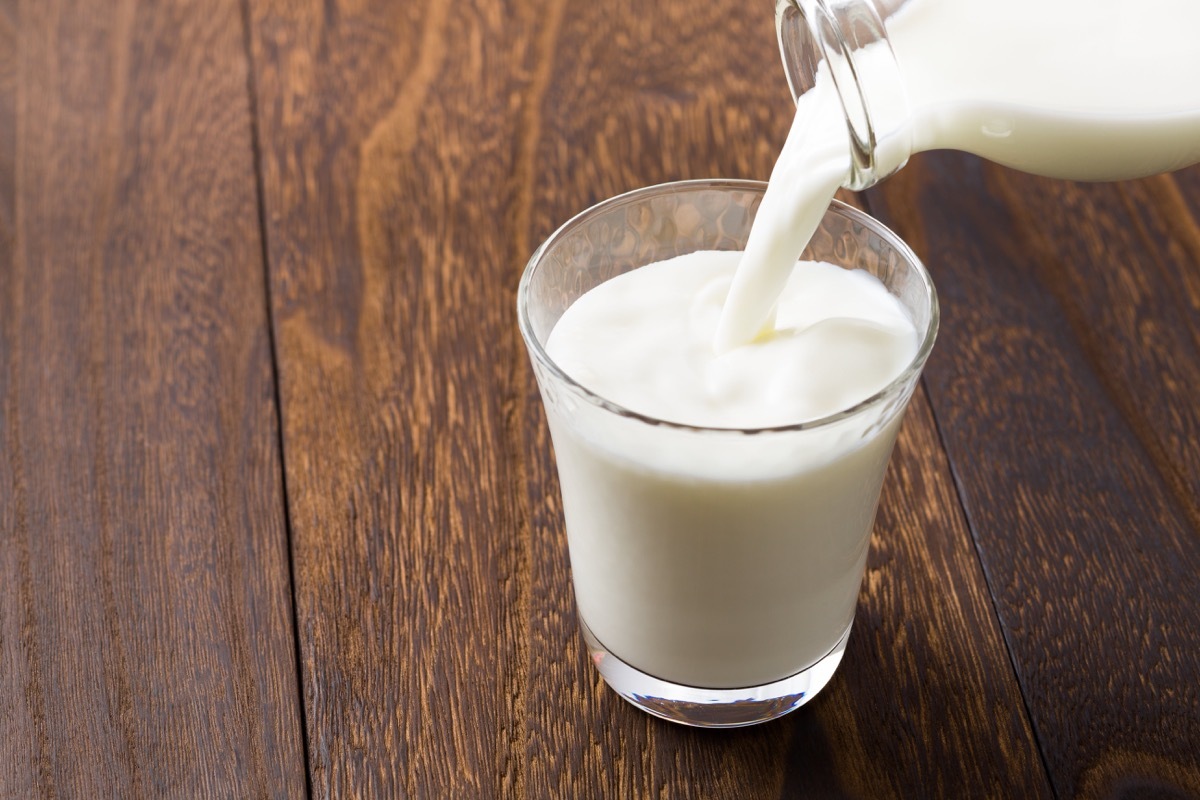 Pouring a Glass of Milk Food Bad for Cats