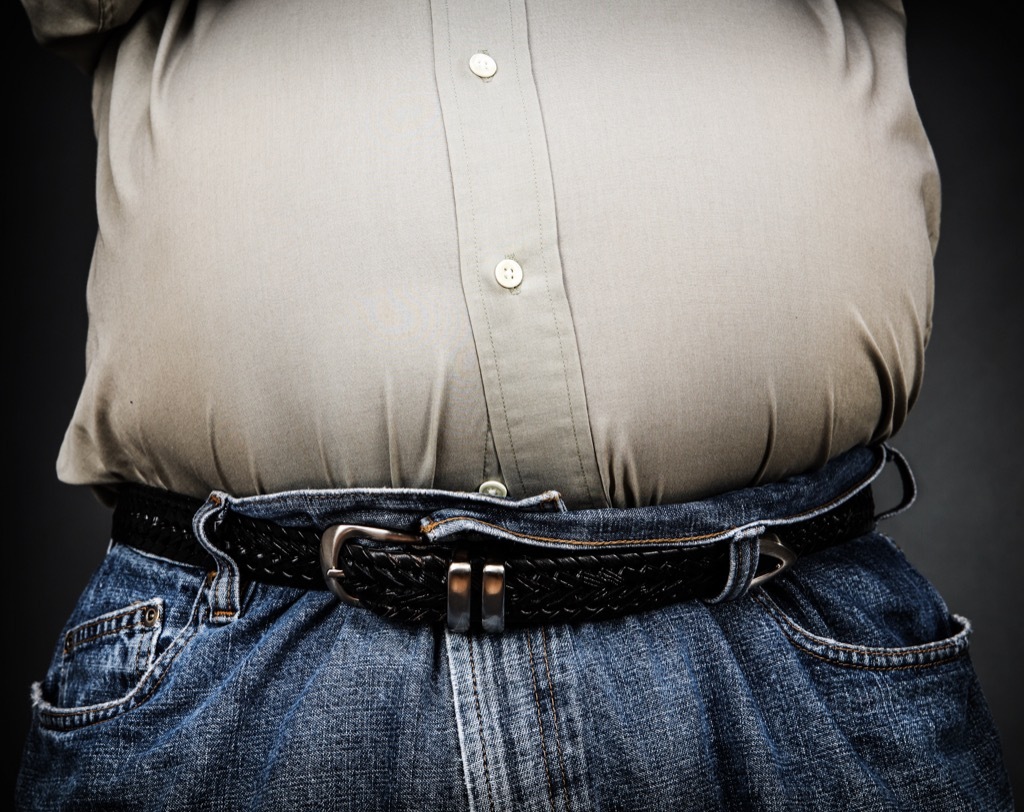 man with bulging stomach, ways your body changes after 40