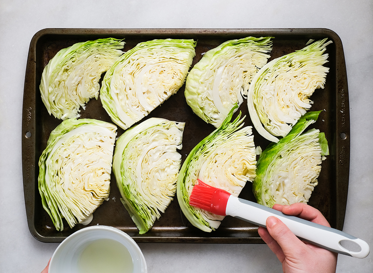 brushing oil on cabbage wedges