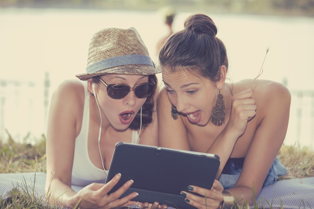 women looking shocked at ipad