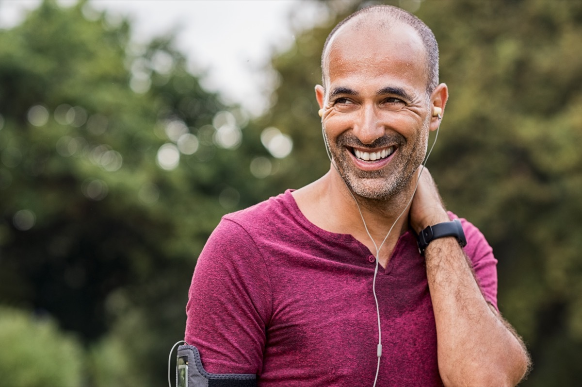 man listening to music while on a run