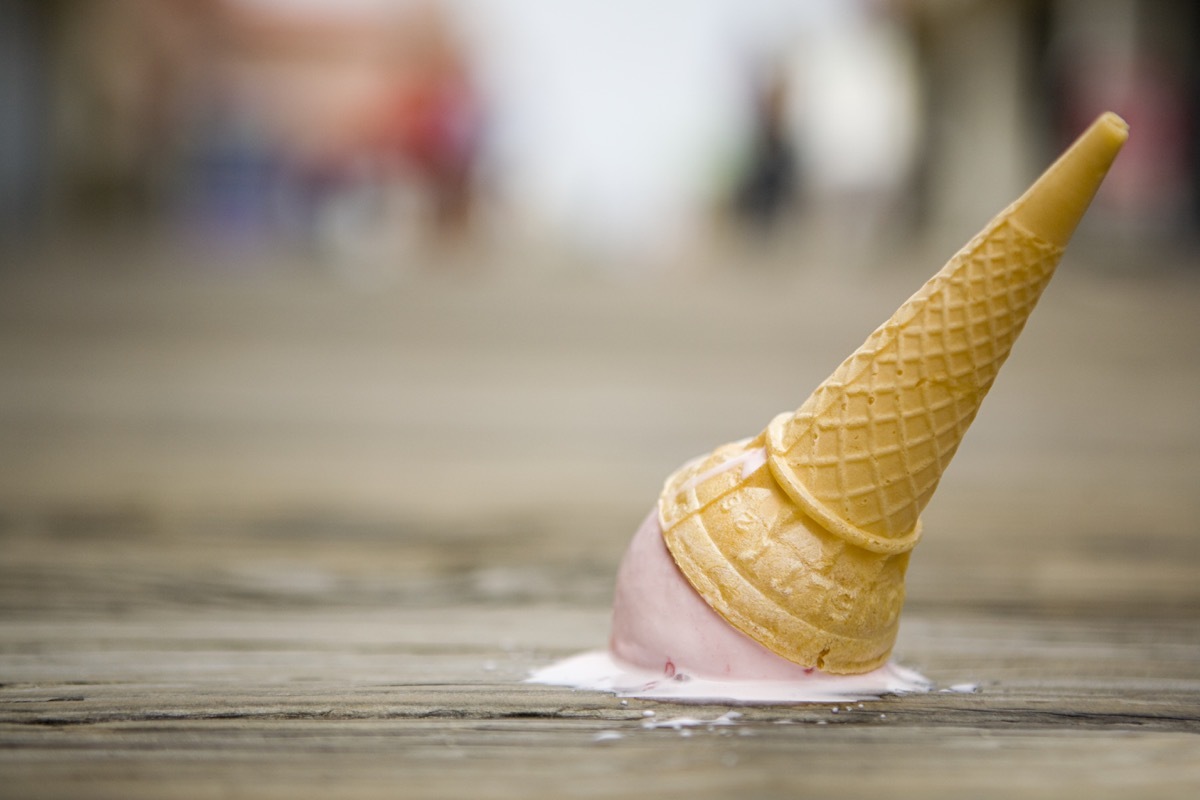 ice cream cone on the floor of a boardwalk