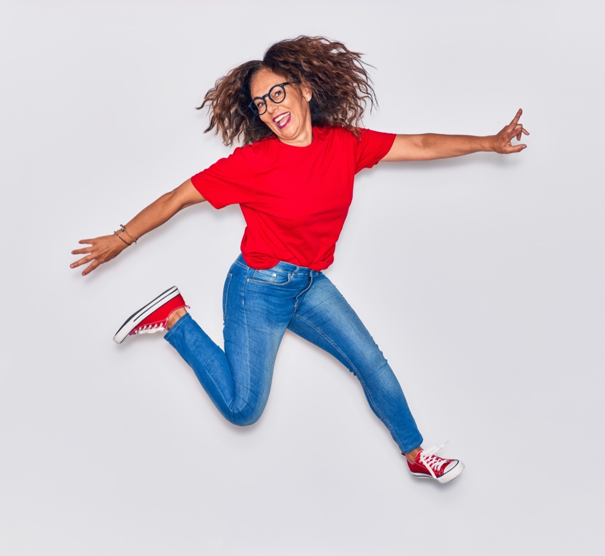 Senior woman jumping for joy