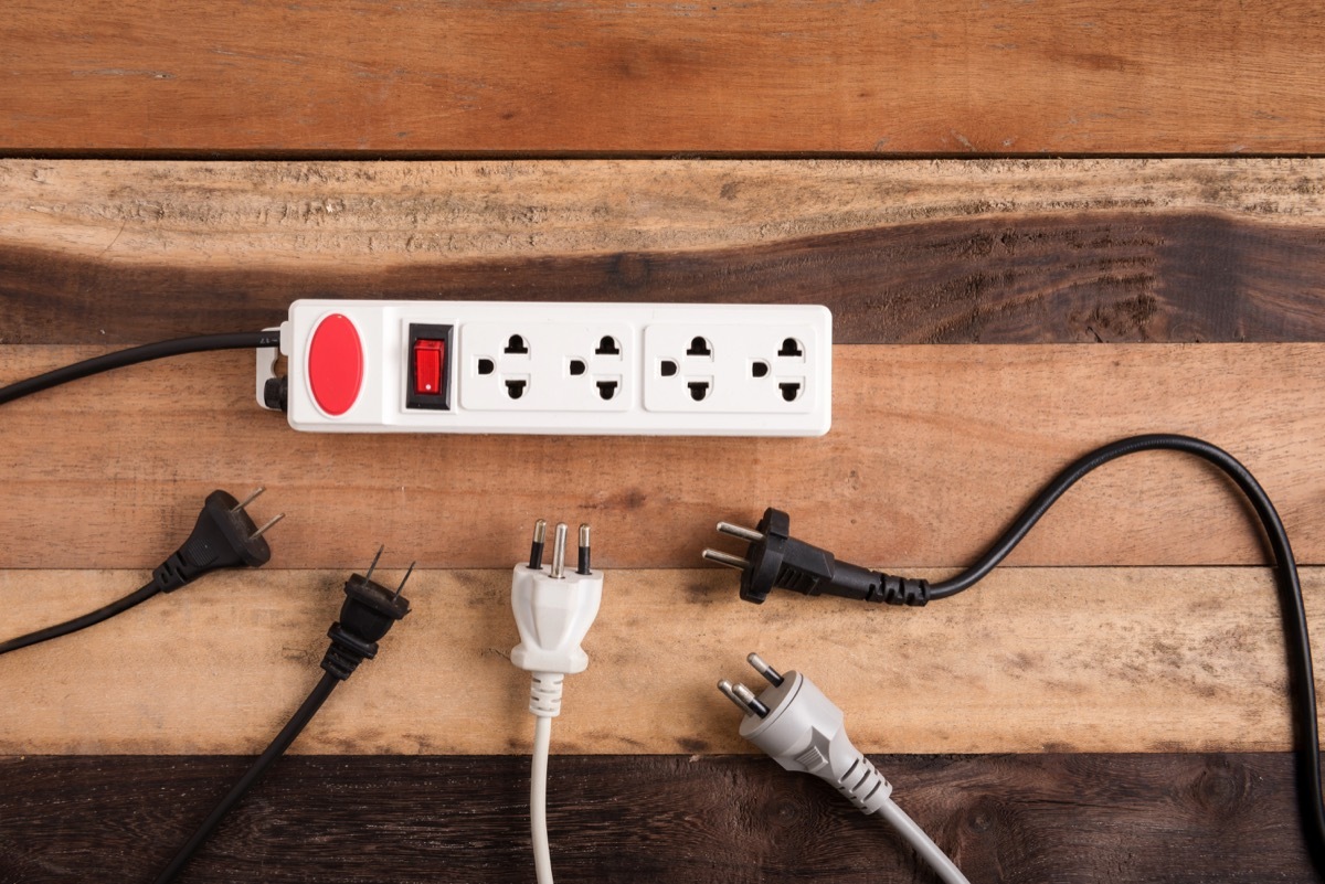 extension cord on the floor with plugs surrounding it