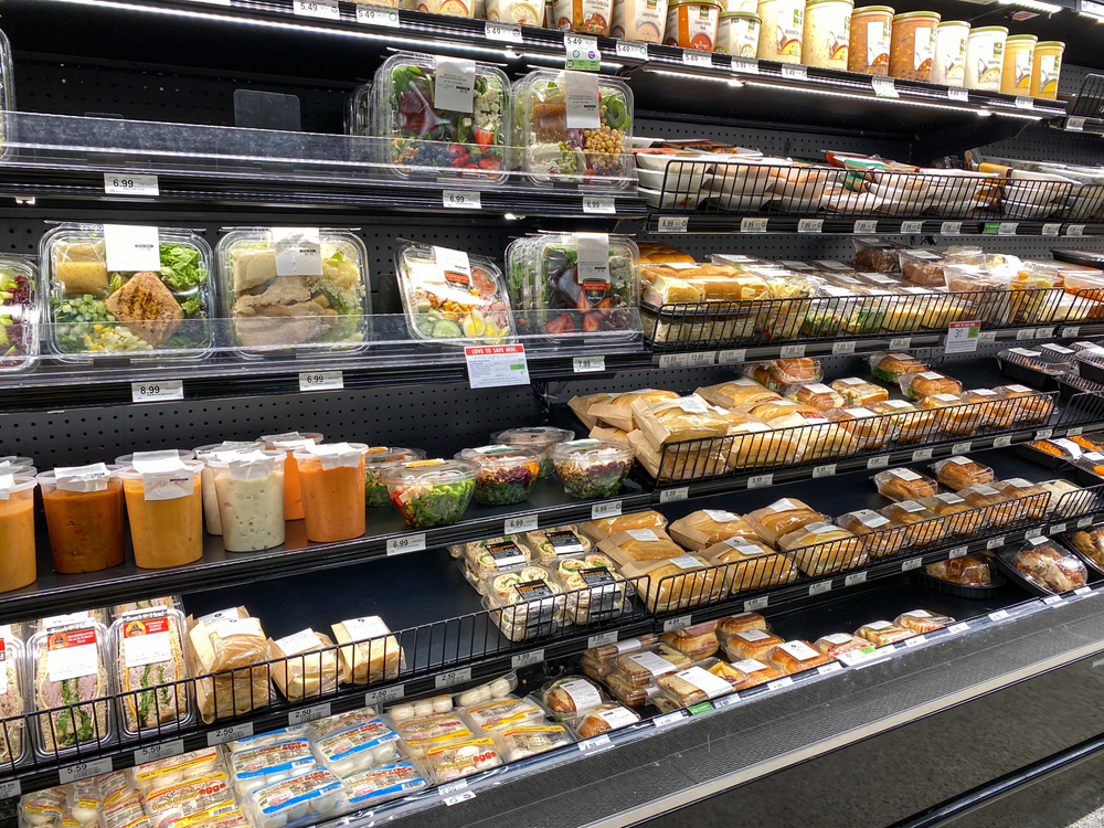 Fresh prepared food packaged and sitting on the shelf in a store's refrigerator