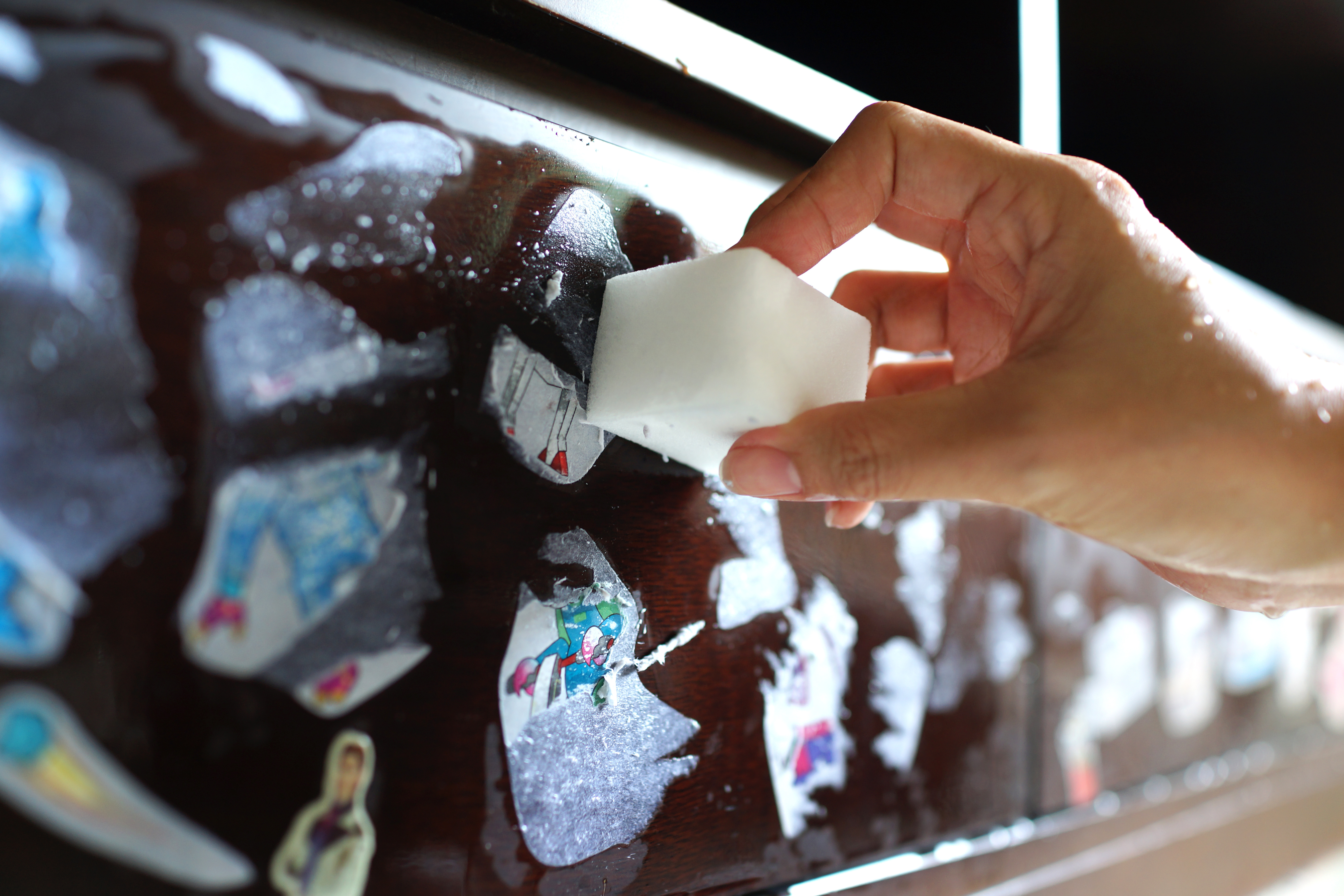 Close-up of hand cleaning with Magic Eraser