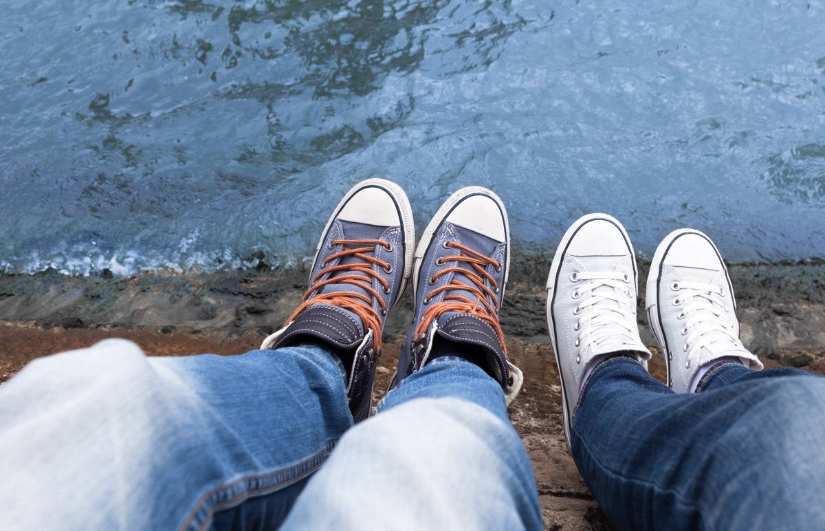 couple wearing converse low top shoes