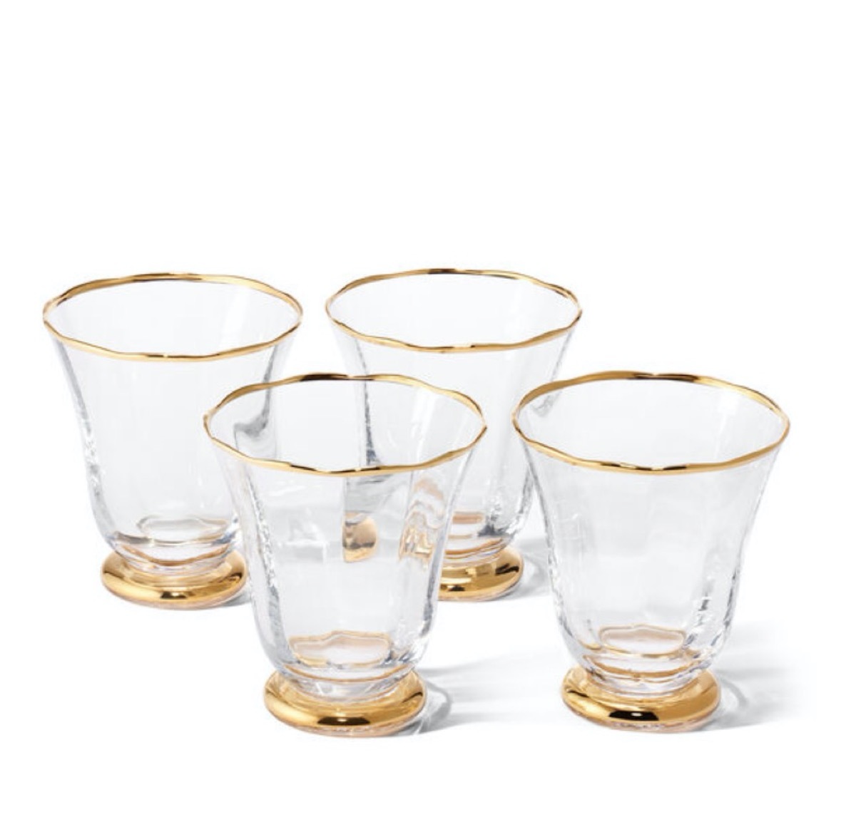 four short glasses with gold rims