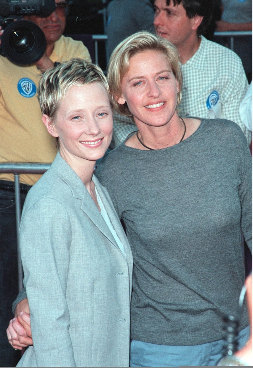 Anne Heche wears a grey jacket and Ellen DeGeneres wears a grey shirt at the premiere of 