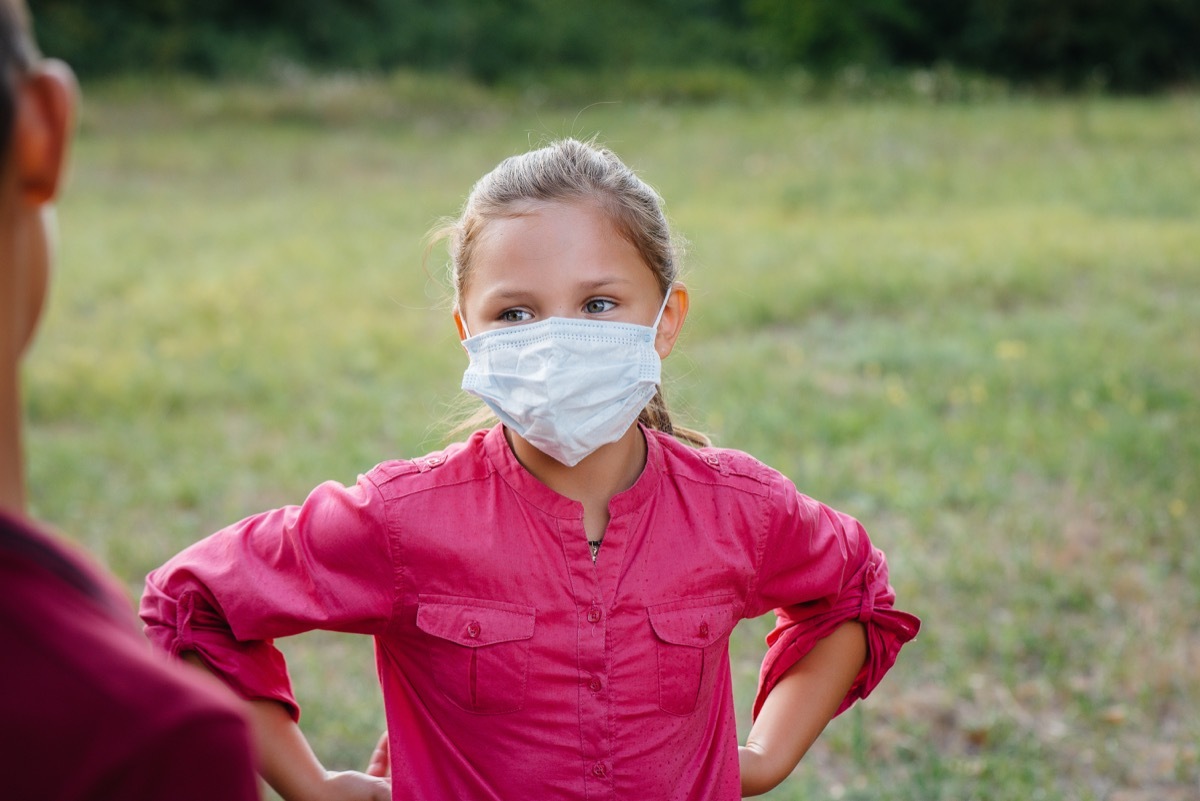 Kid outside in mask