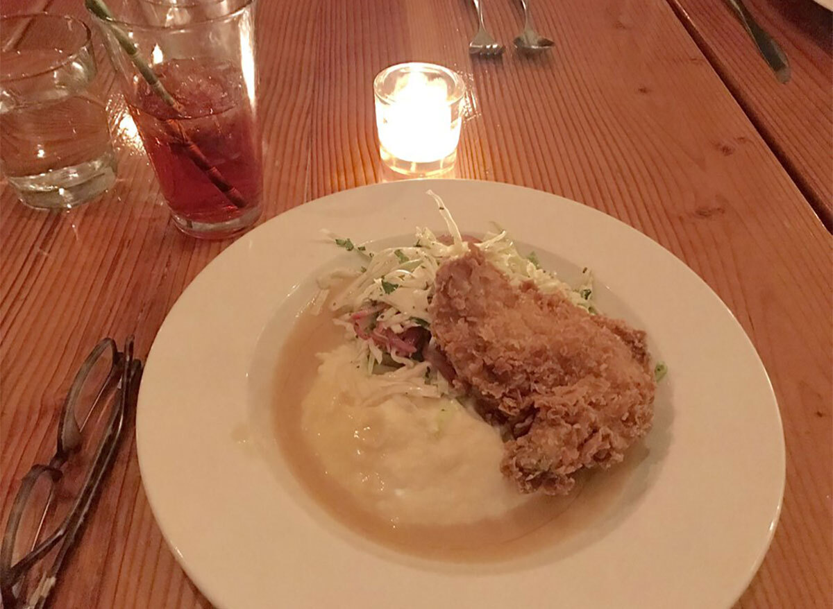 plate of fried chicken with mashed potatoes and coleslaw