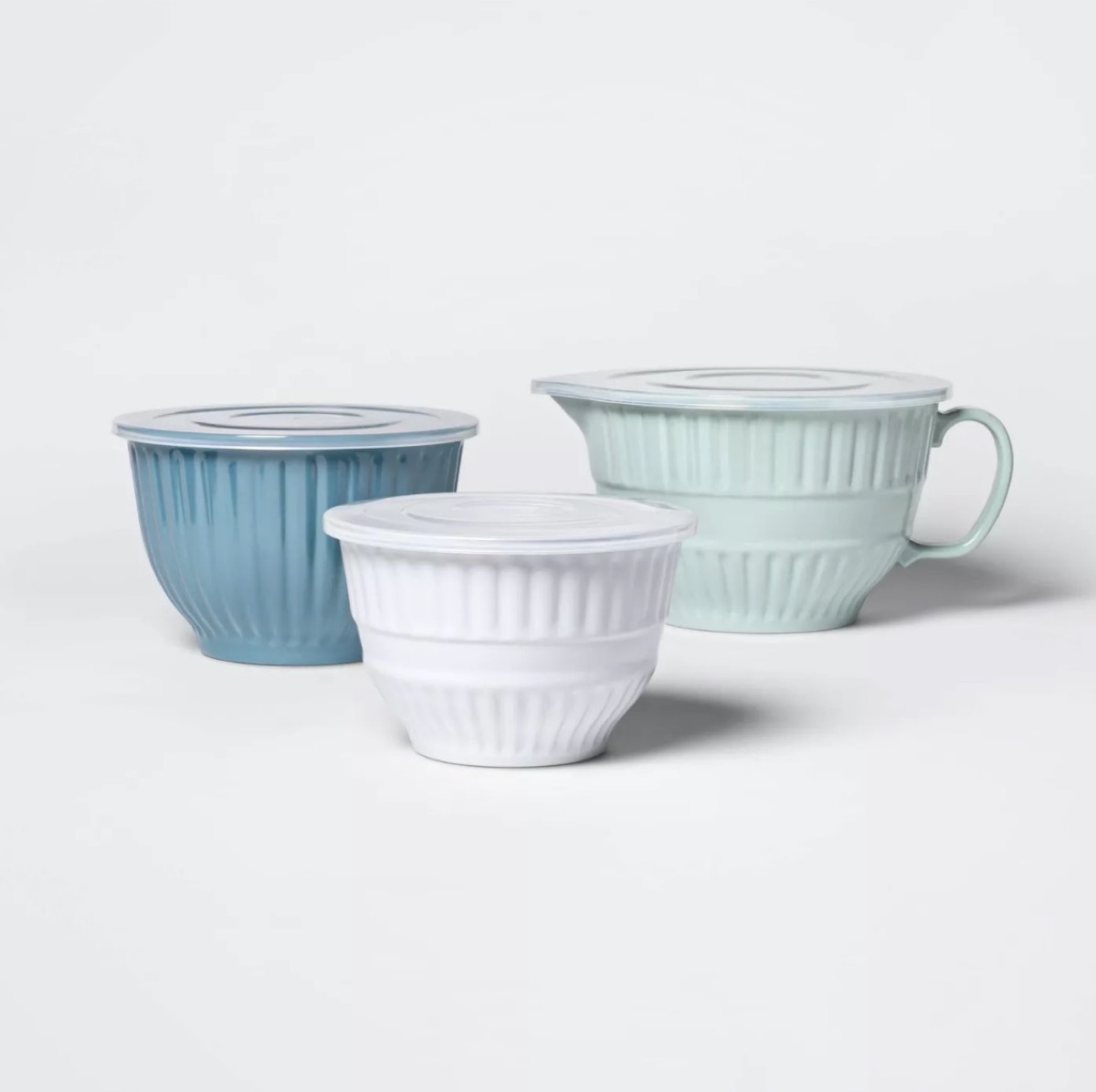 three ceramic bowls in shades of blue and white