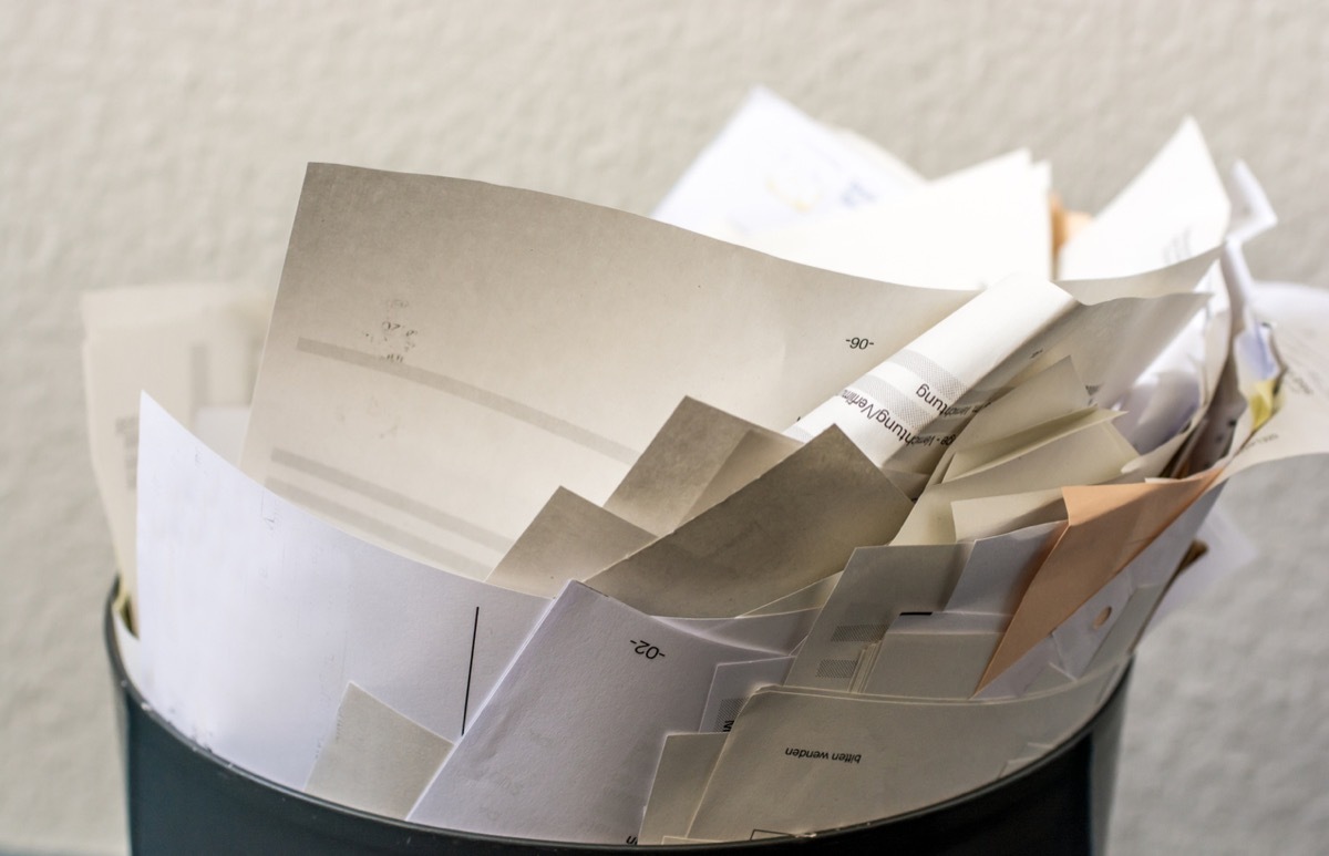 Overfilled recycle bin with paper