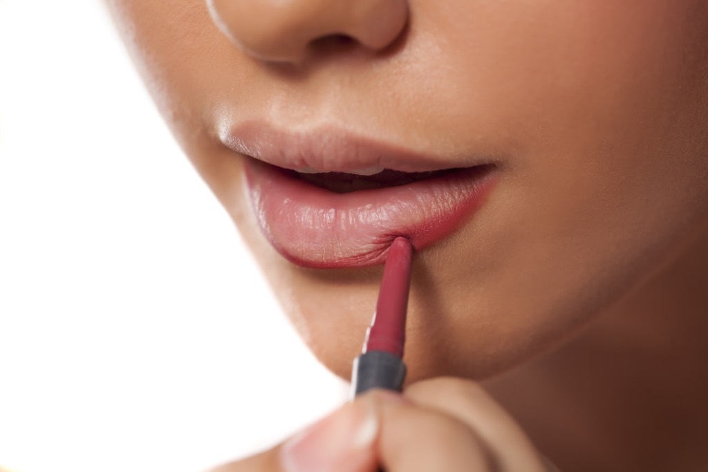 woman lining lips, makeup for older women